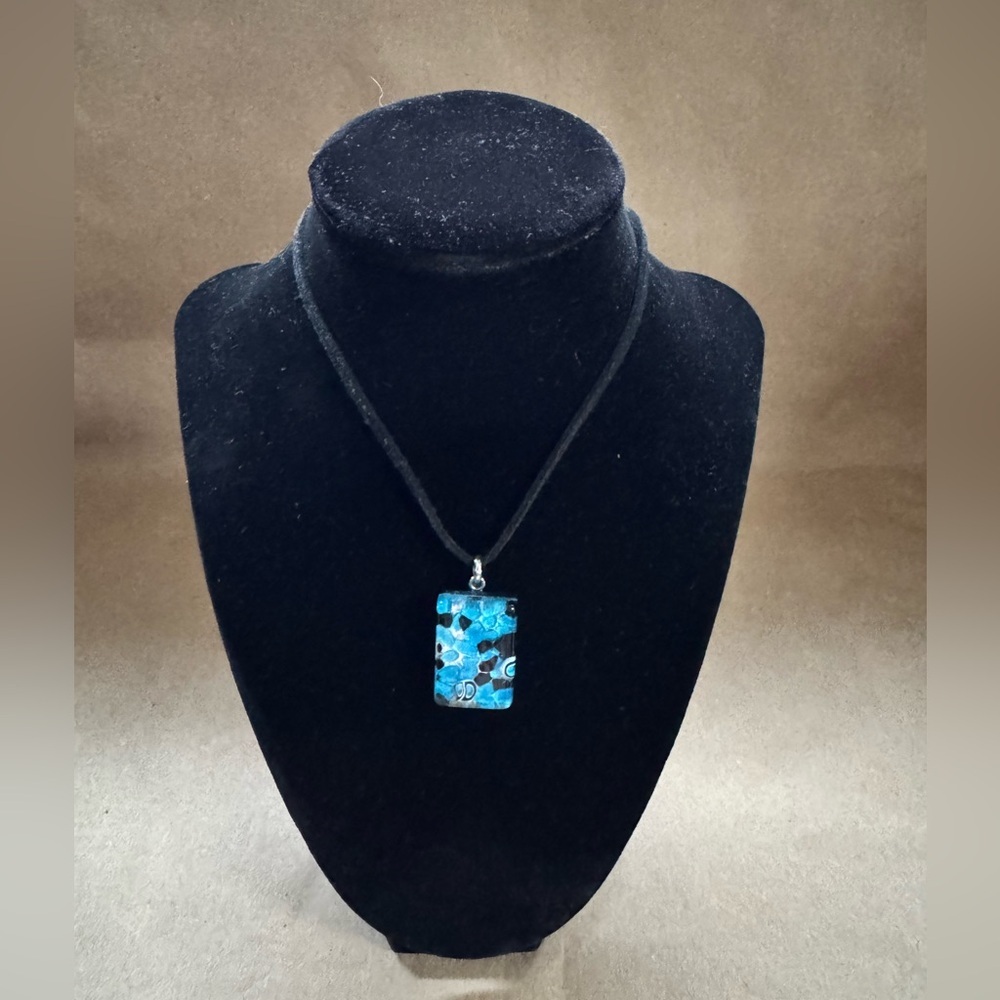 NWOT Murano Glass Pendant in Blue, Black & silver. 1” by 0.75” by .25”